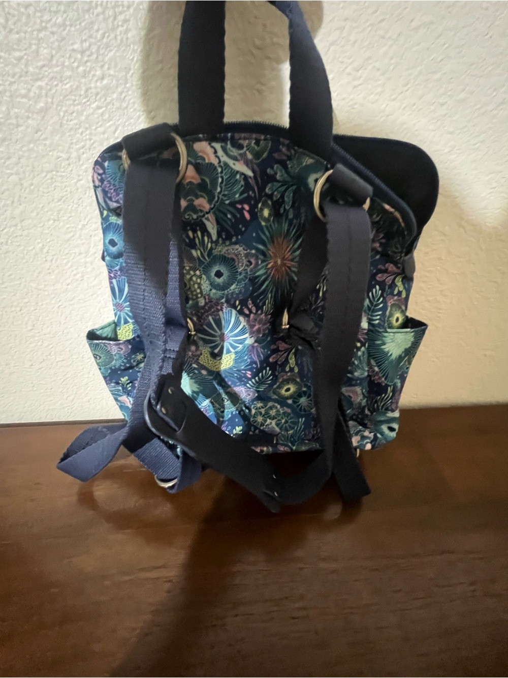 Sakroots Navy Floral Mini Backpack with Teal, Aqua & Lavender Accents - Picture 2 of 11